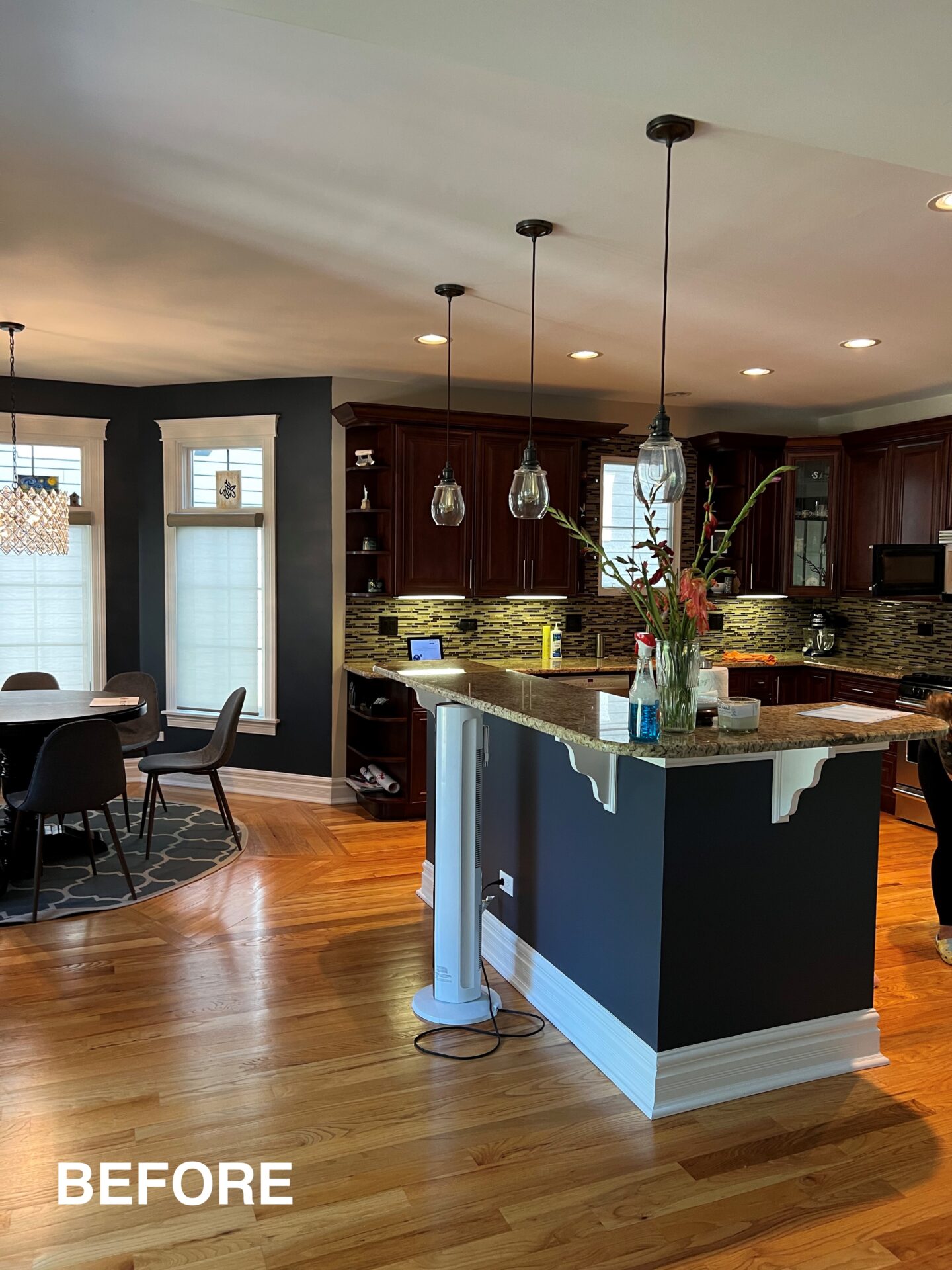 Before kitchen, cherry cabinets, two-tiered kitchen island