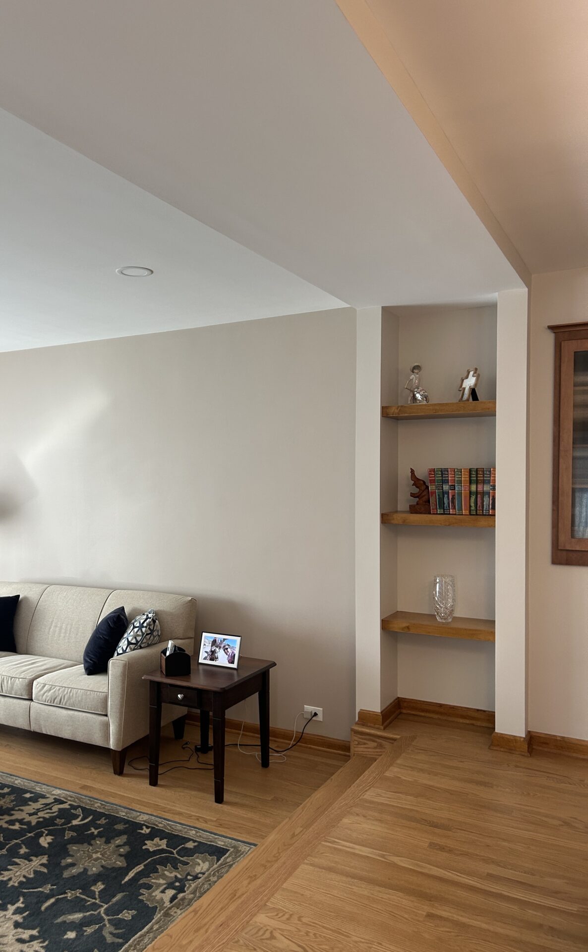 Shallow soffit and built-in bookcase with floating shelves
