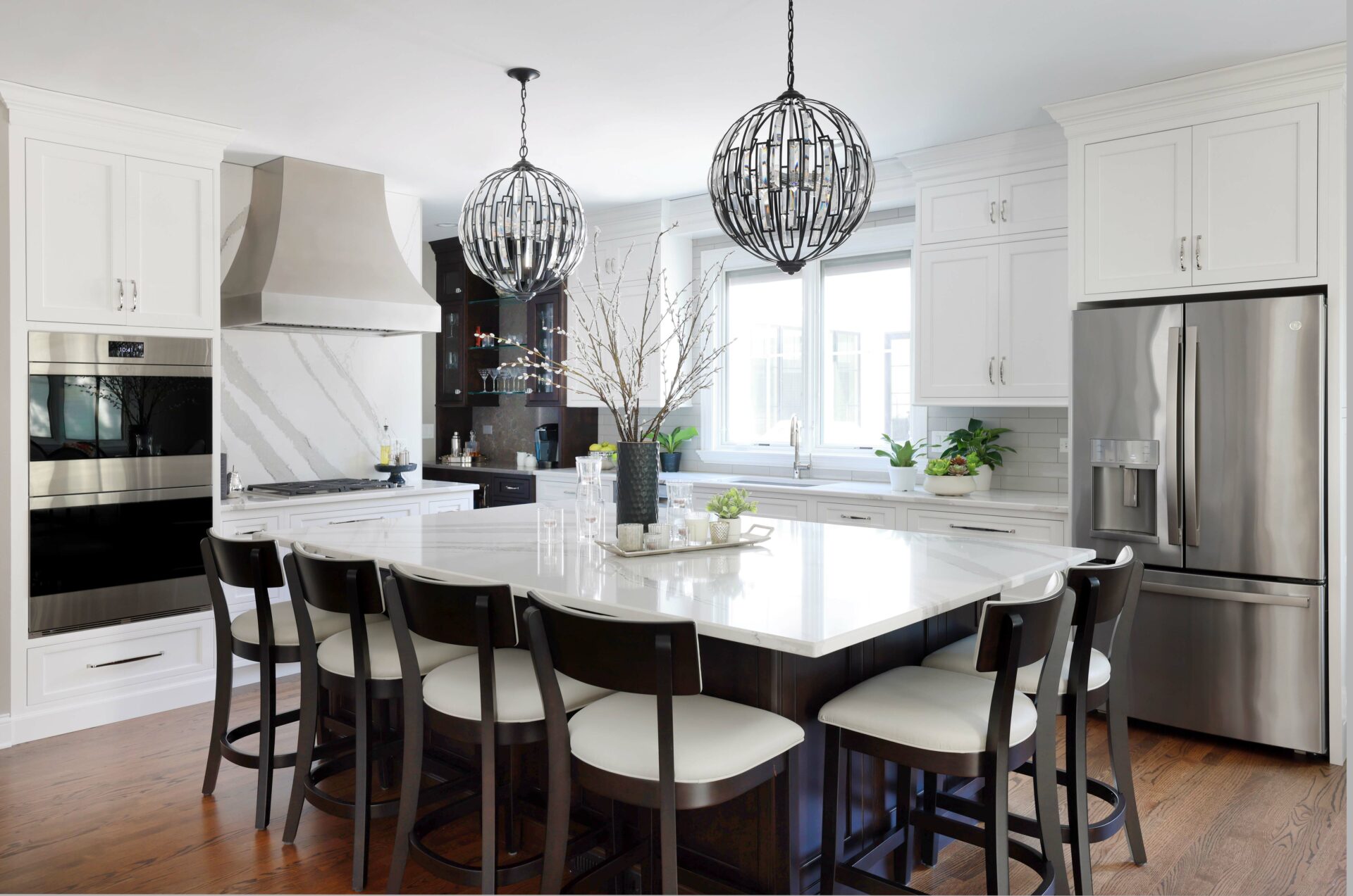 white kitchen with large island that seats six