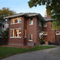 Two story brick home addition for a larger kitchen and bedroom above