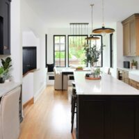 Rift cut white oak kitchen with black island and kitchen desk