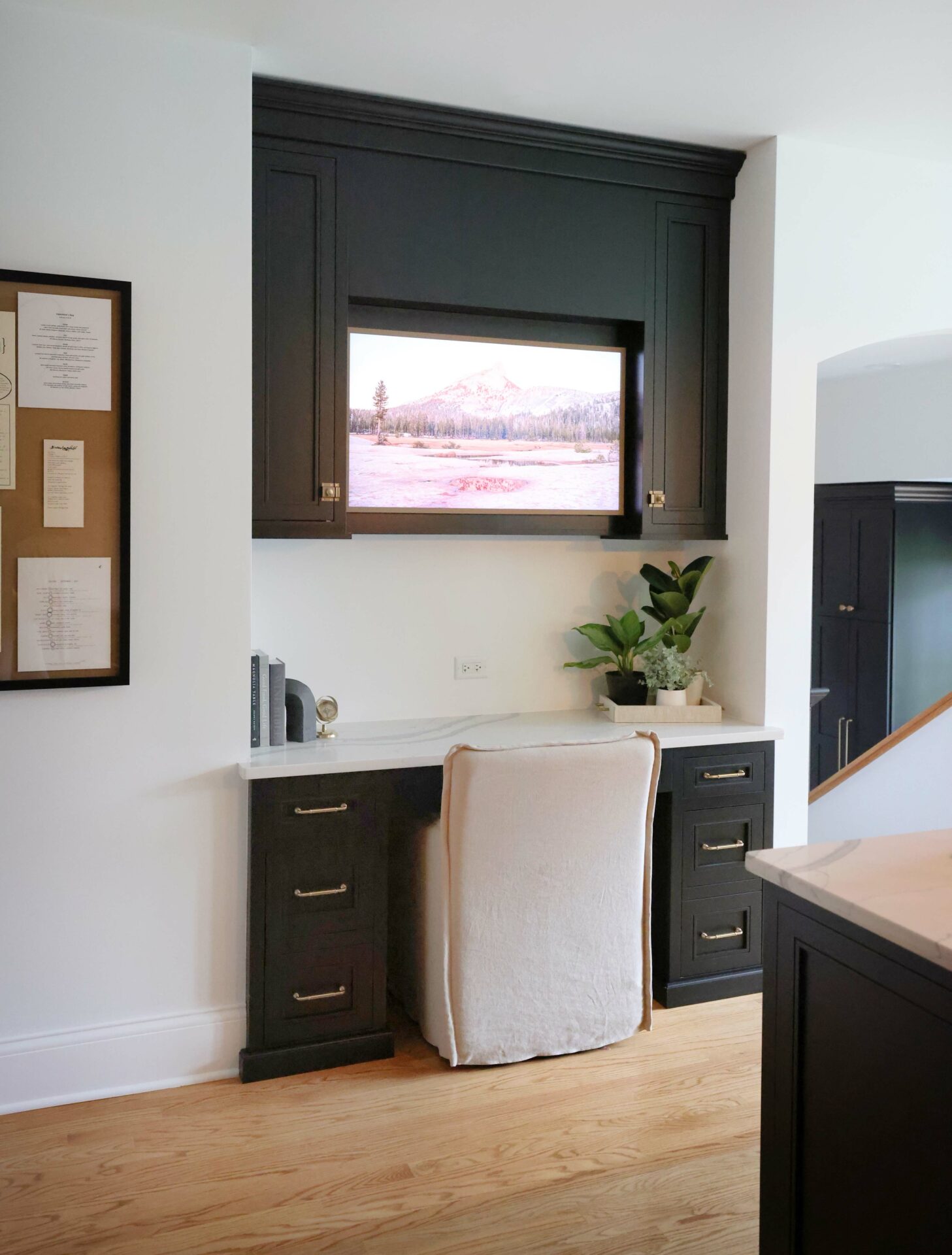 Desk in the kitchen with built-in television