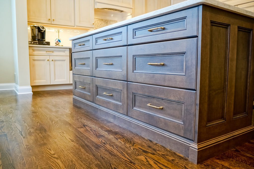Dark wood center island with drawers for storage
