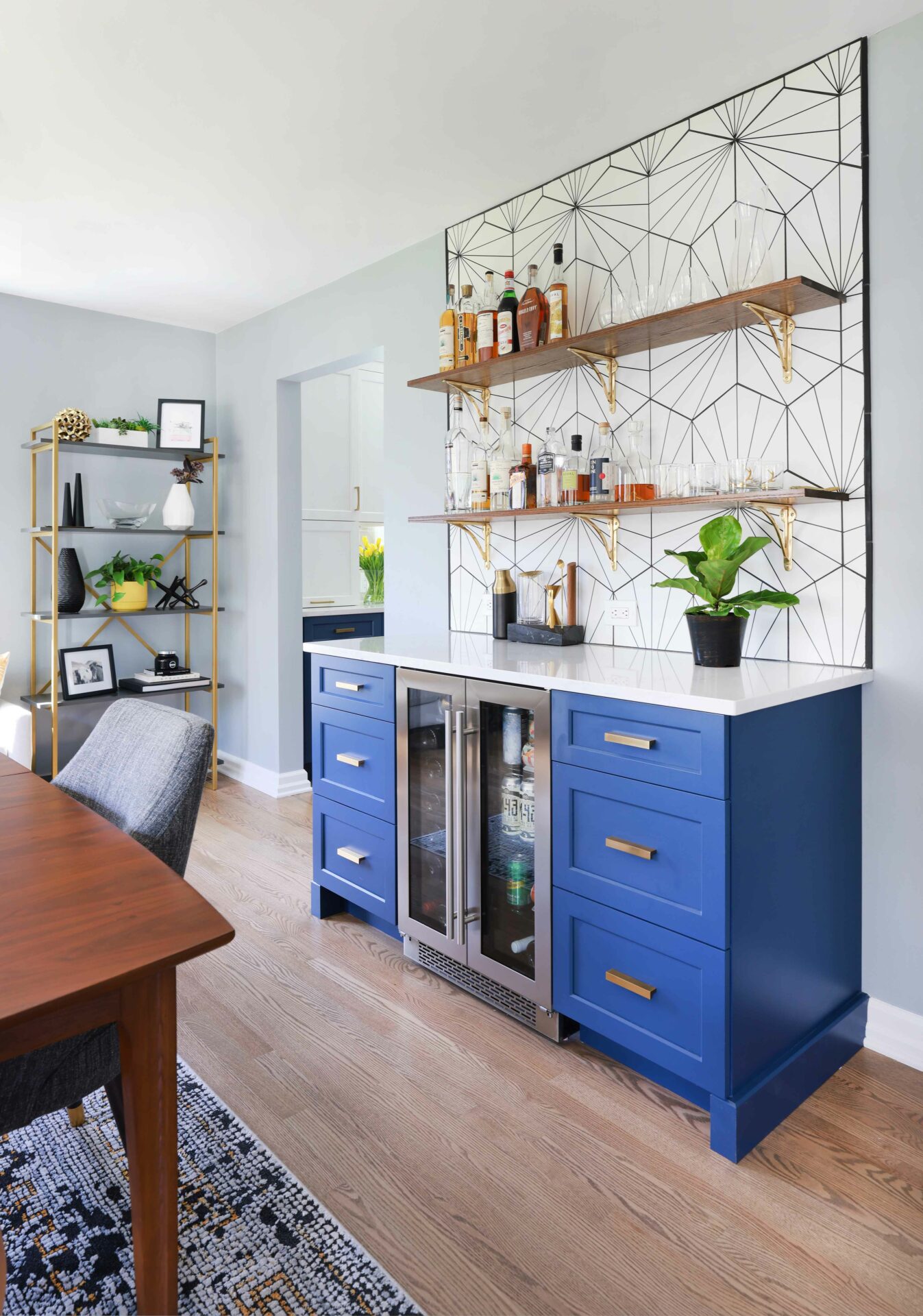 Blue bar with mid-century modern inspired tile backsplash