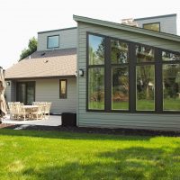Sunroom addition peaked roof wall of windows