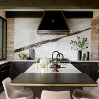 black kitchen with porcelain slab backsplash