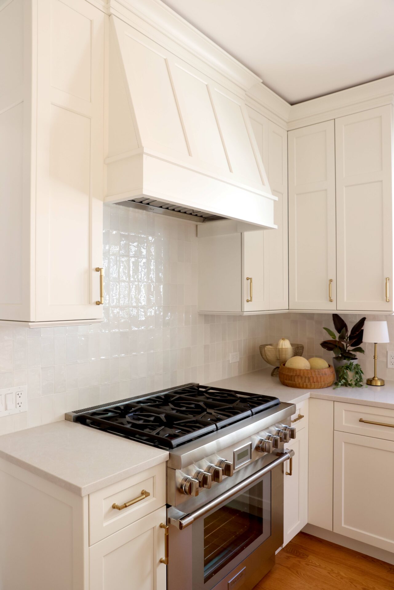 Ivory kitchen with mantle style hood