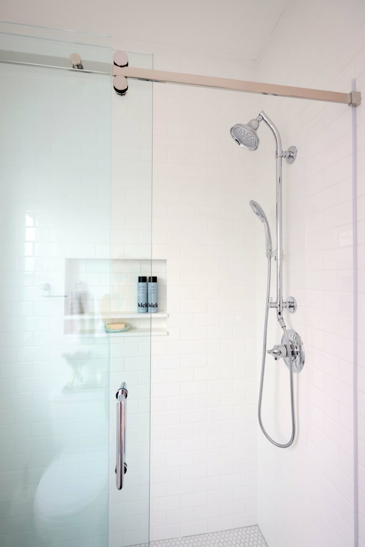 Shower with sliding barn door style shower door