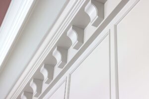 Painted corbels in kitchen at ceiling, decorative molding, color drenched