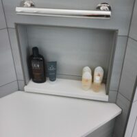 Shower niche with bench and grab bar