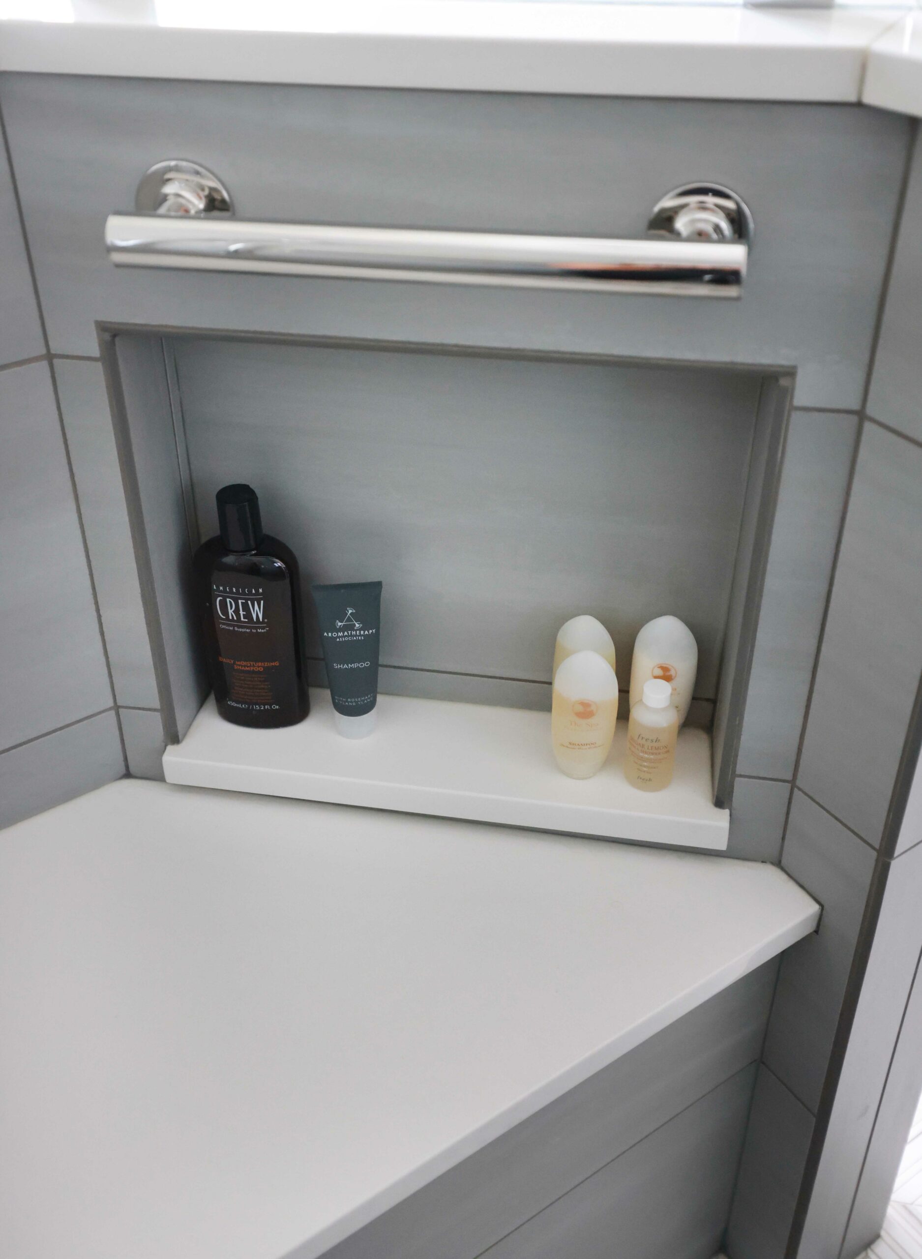 Shower niche with bench and grab bar