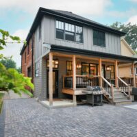 two story home addition with a back porch