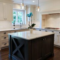 white kitchen with dark stained island