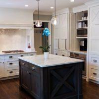 white kitchen with paneled refrigerator