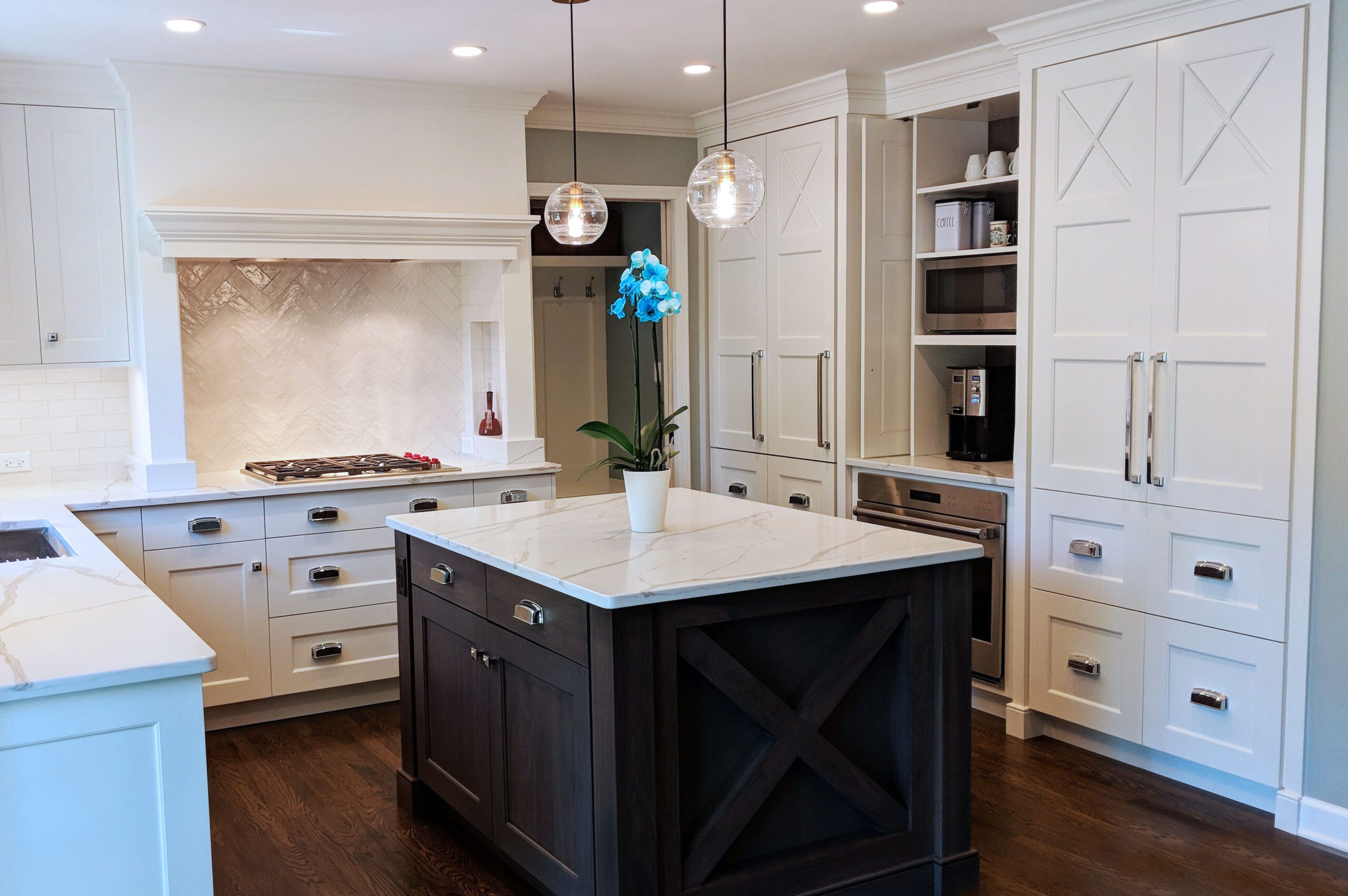 white kitchen with paneled refrigerator