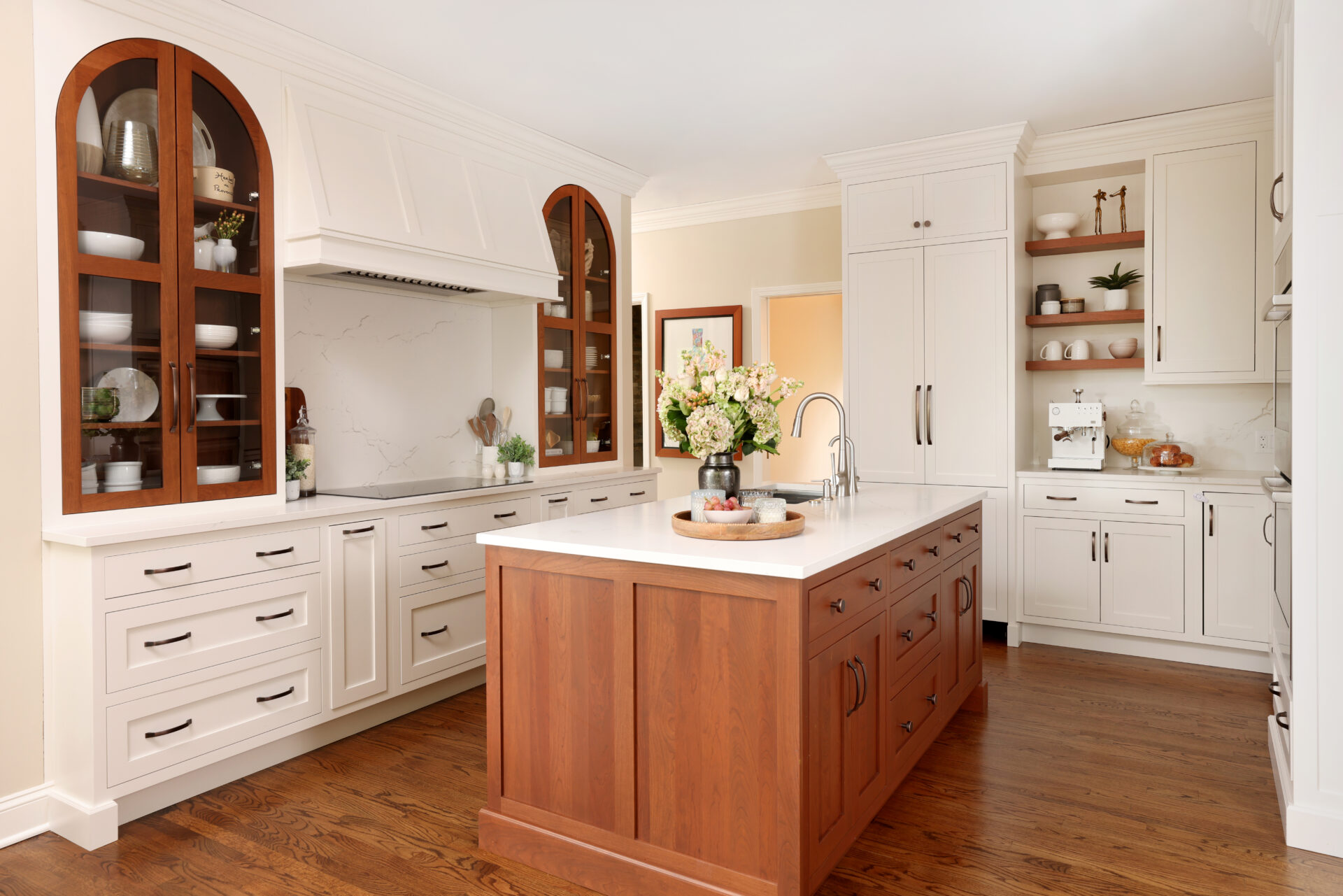 kitchen with cherry arched cabinet wall