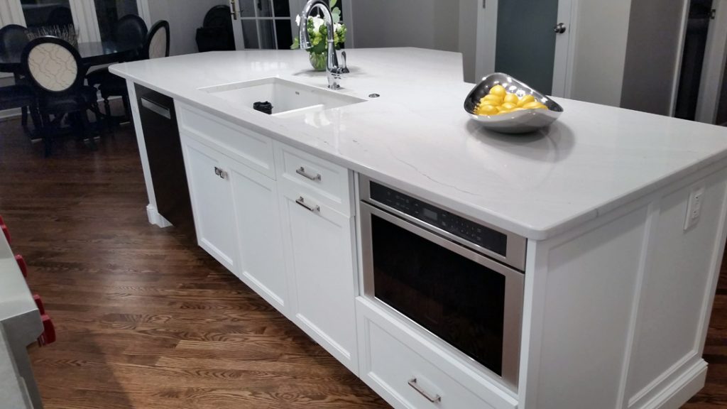 Kitchen island with appliance and sink