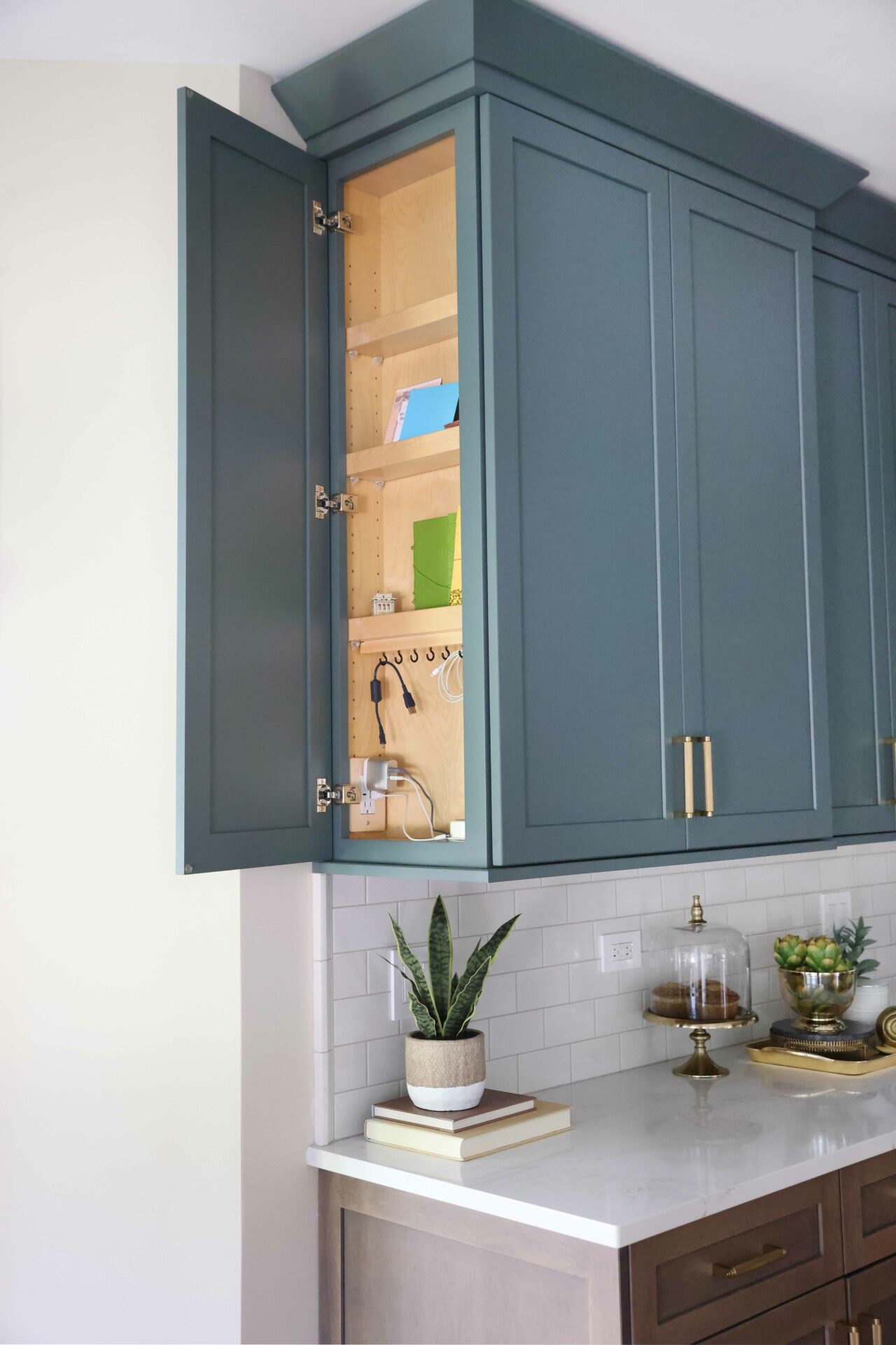 side of the upper kitchen cabinet opens to reveal a message center