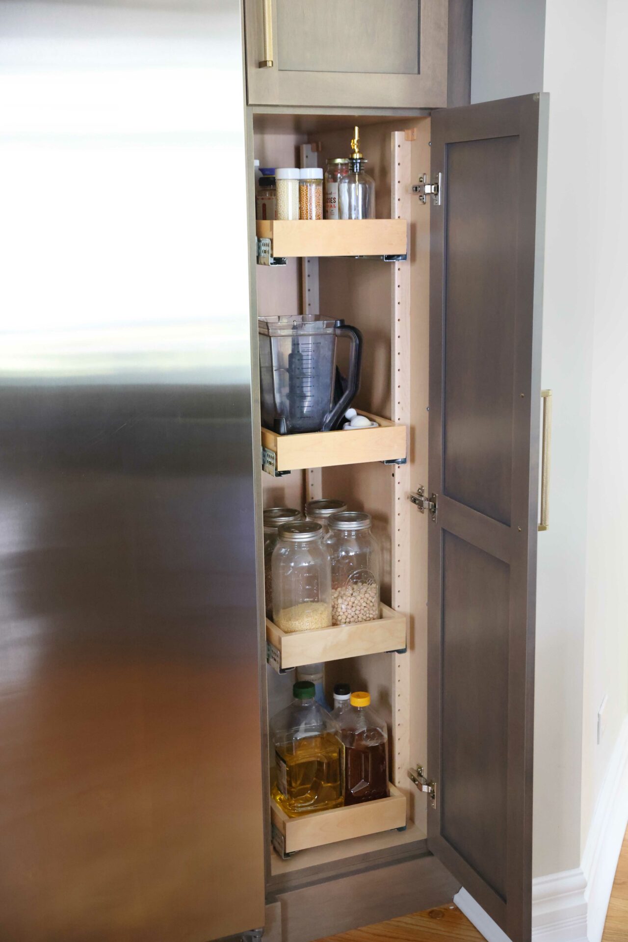 Roll out shelves in a slim kitchen cabinet