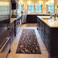 Stained kitchen cabinets with light countertops