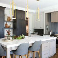 Rift cut white oak kitchen cabinetry in dark and light stains, paired with painted cabinetry at the perimeter