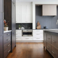Texture and drama make this contemporary traditional kitchen design so striking