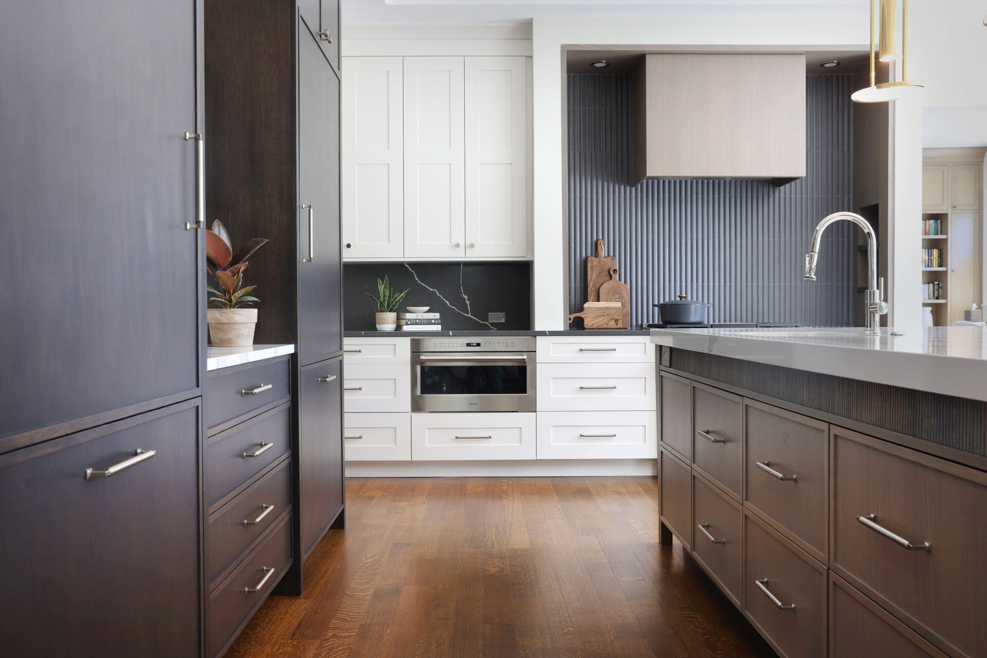 Texture and drama make this contemporary traditional kitchen design so striking