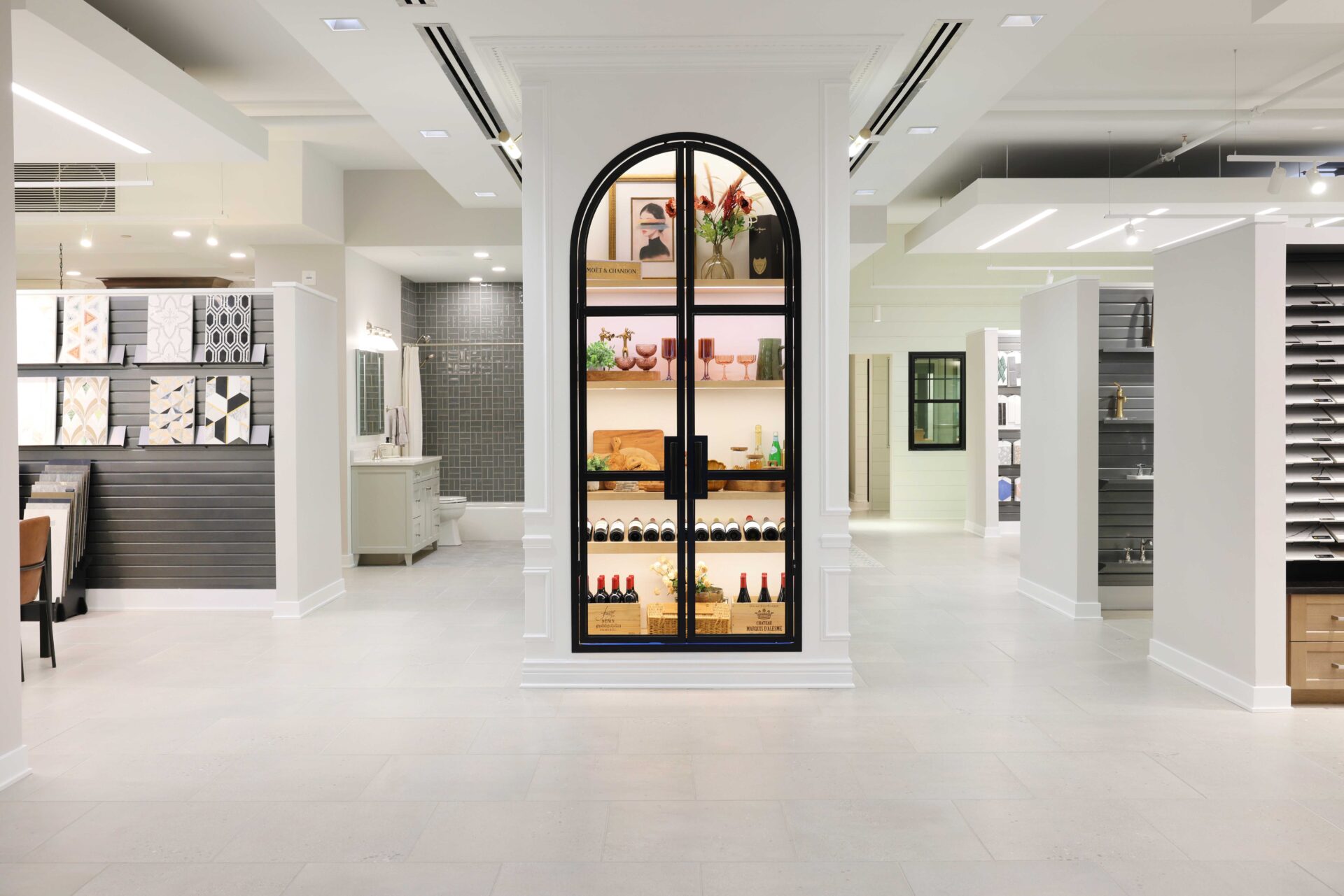 Display case with black metal and glass arch doors
