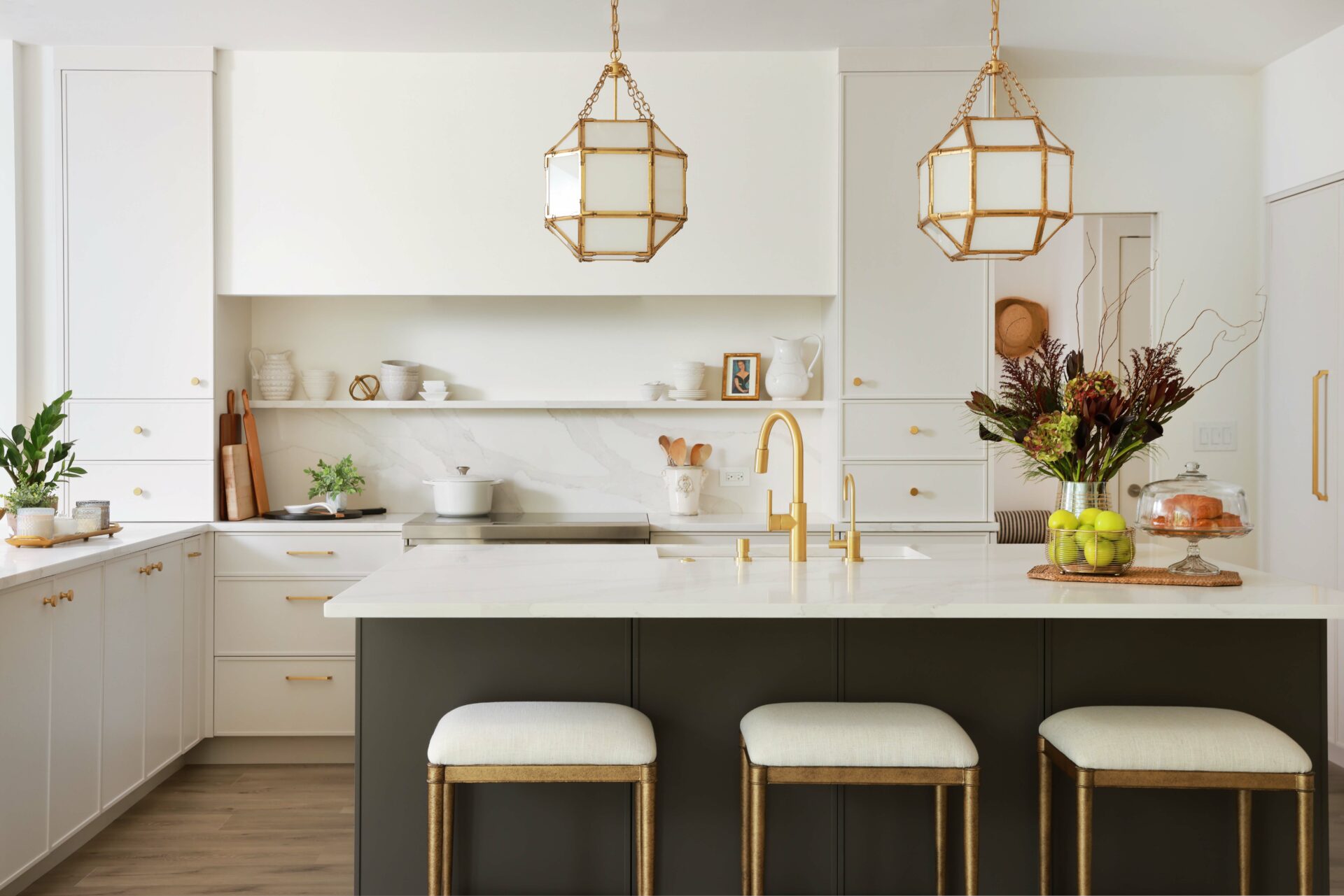 white modern kitchen with minimalist drywall hood and dark painted island