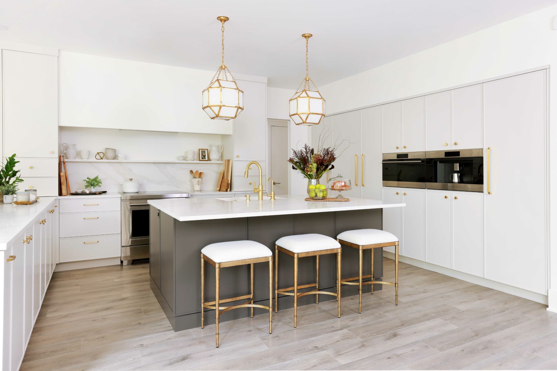 Modern off-white kitchen with dark gray painted island