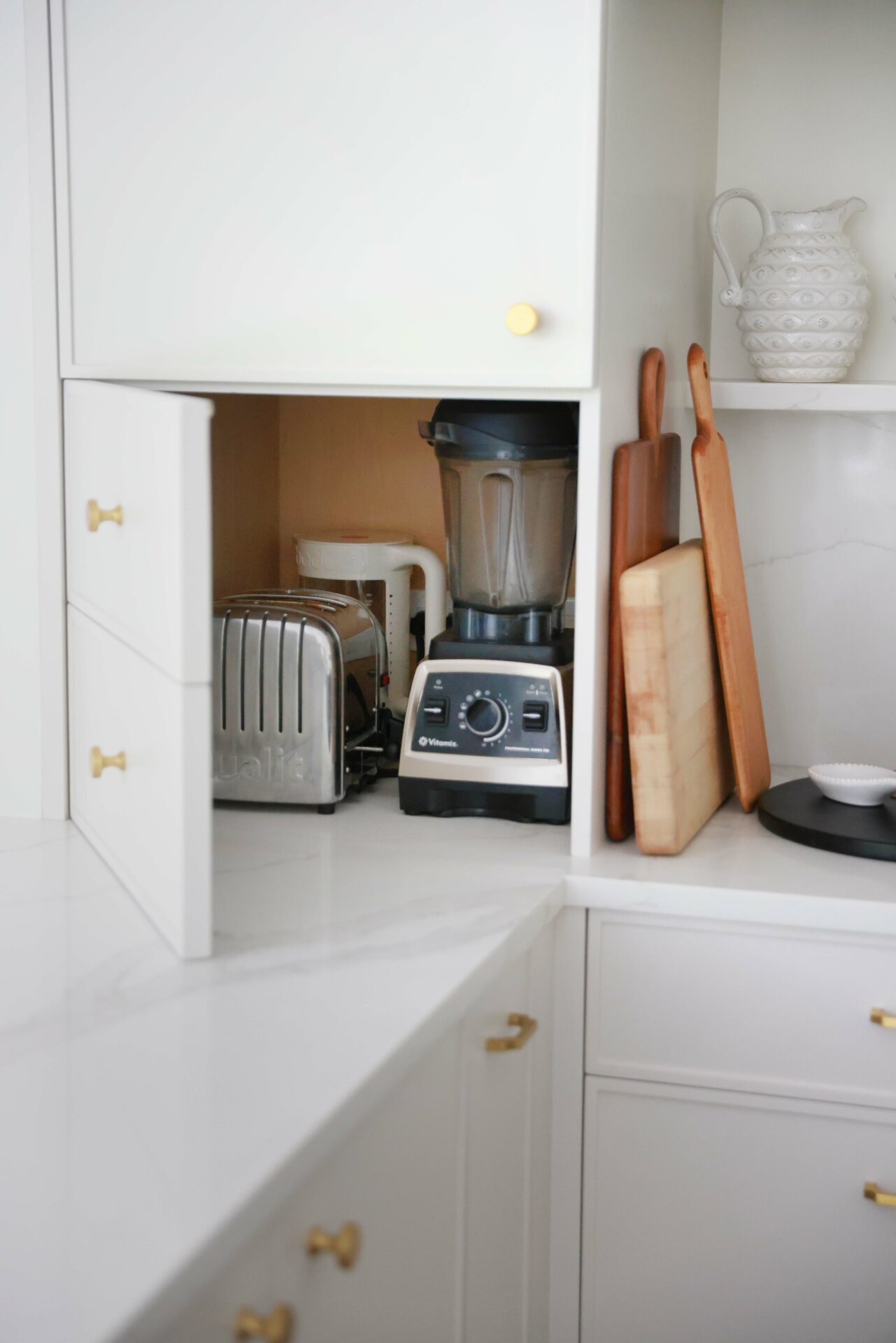 appliance garage with swing door that looks like drawers