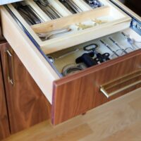 utensil divider drawer in Mid Century modern kitchen with walnut cabinets