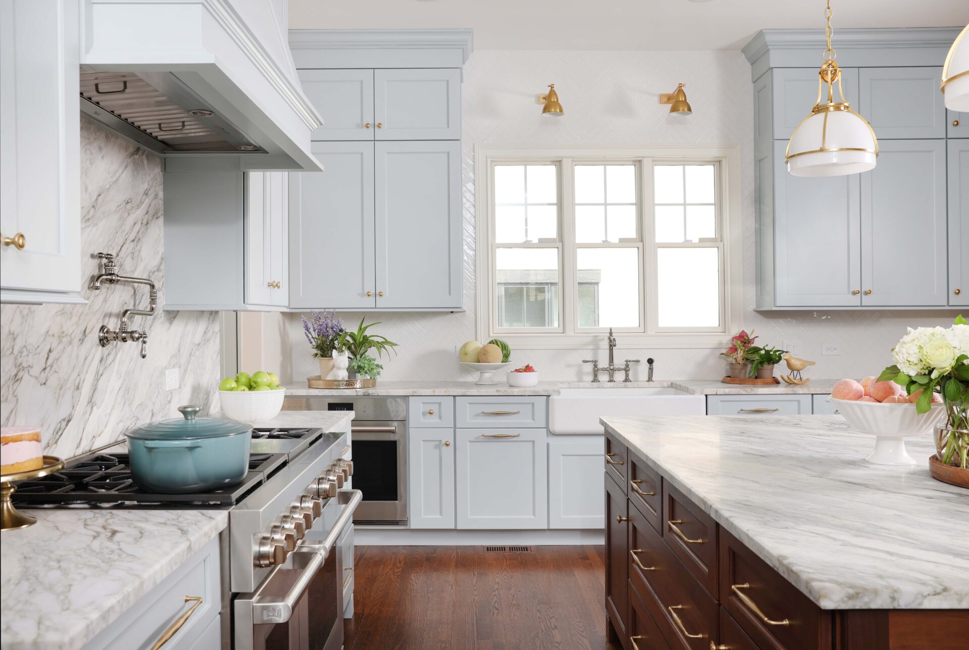 New Traditional style kitchen in a soft blue color with a stained walnut kitchen island